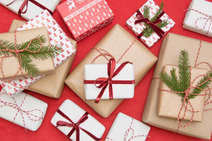 Wrapped Christmas gifts on red background